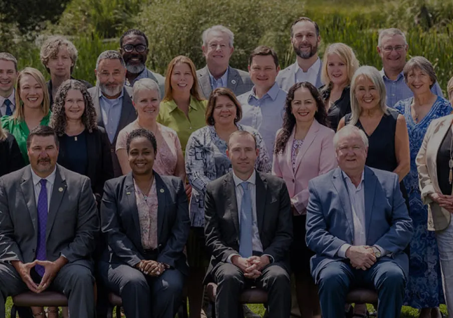 Group portrait of diverse professionals outdoors at National Center for State Courts